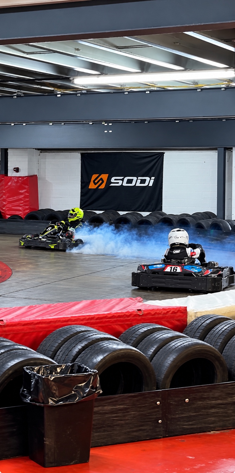Buckley's kart surrounded by a cloud of blue smoke during his first engine failure at Anglia Karting